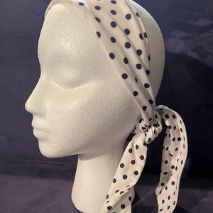 White and navy blue polkadot head scarf.
